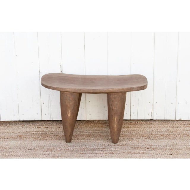 Senufo stools and side tables are traditionally made by the Senufo people, who live in West Africa. This primitive stool...