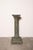 A striking antique French display pedestal featuring a monumental barley twist column, stepped base, and beautifully...
