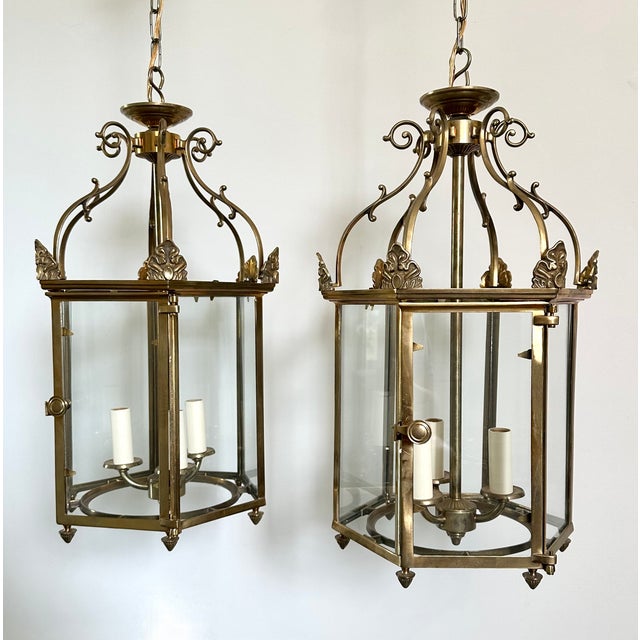 Pair of Vaughan Designs Regency style hexagonal ceiling lanterns. Solid brass with glass panels. Each 3 arm light cluster...