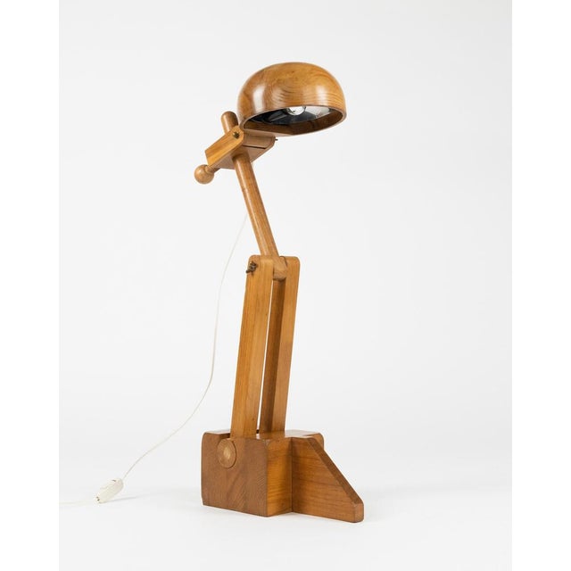 Midcentury amazing adjustable sculpture table lamp in solid wood by Paolo Pallucco for Pallucco Roma. Made in Italy in the...