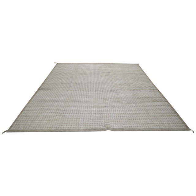 Hand-knotted with care using traditional rug making techniques, this wool rug blends timeless craftsmanship with a modern...