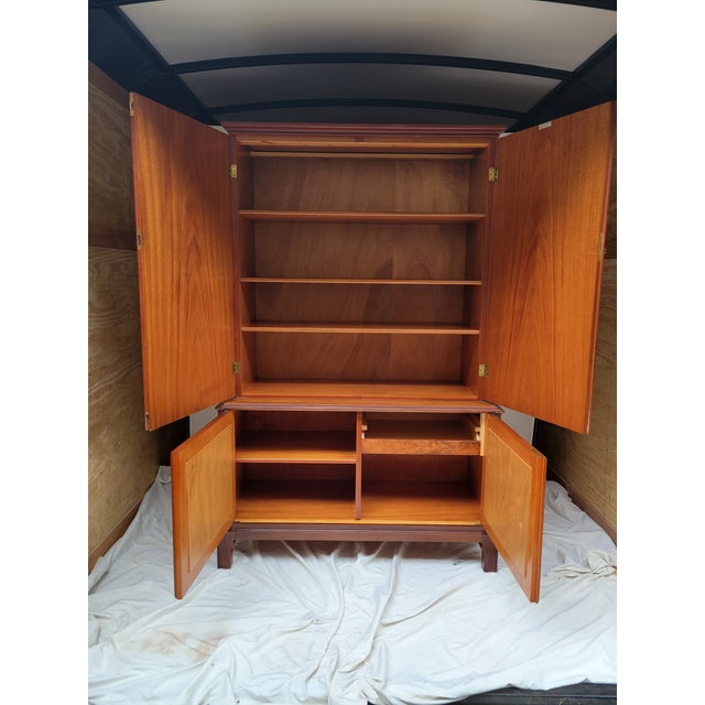 Stunning Swedish mid-century modern storage cabinet in golden elm and mahogany. Designed by J.O. Carlssons circa the...