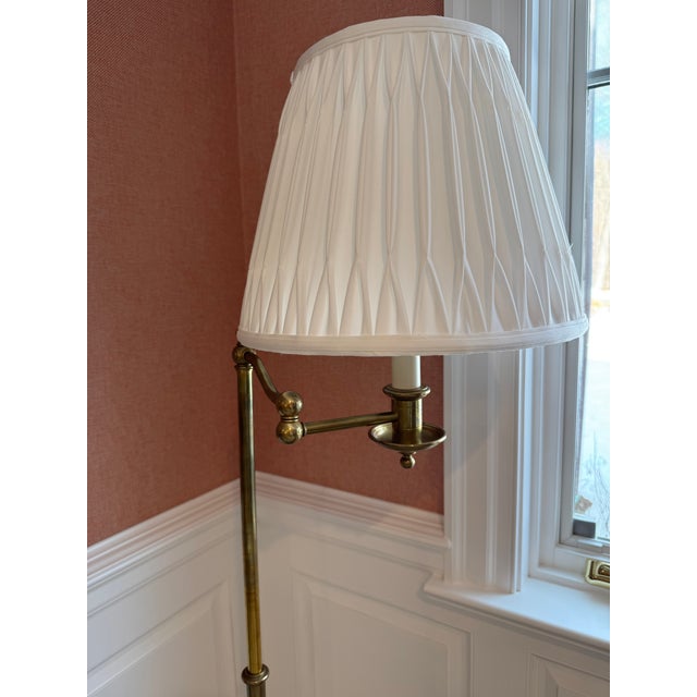 An elegant lighting piece from Ralph Lauren Home, this Sargent swing arm floor lamp merges timeless design with functional...