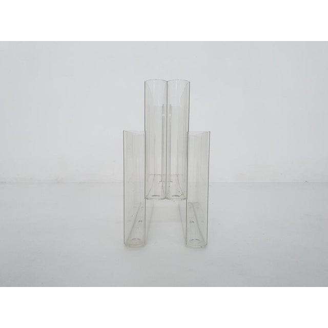 Transparent plastic magazine stand by Giotto Stoppino for Kartell, with 4 places for magazines. Marked at the bottom...