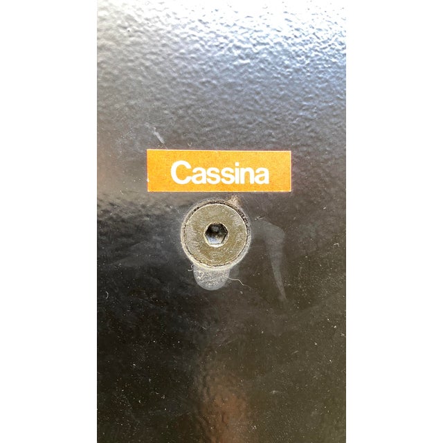 This Cassina Wood and Metal Side Table is an stylish addition to any living space. A combination of solid wood and coated...