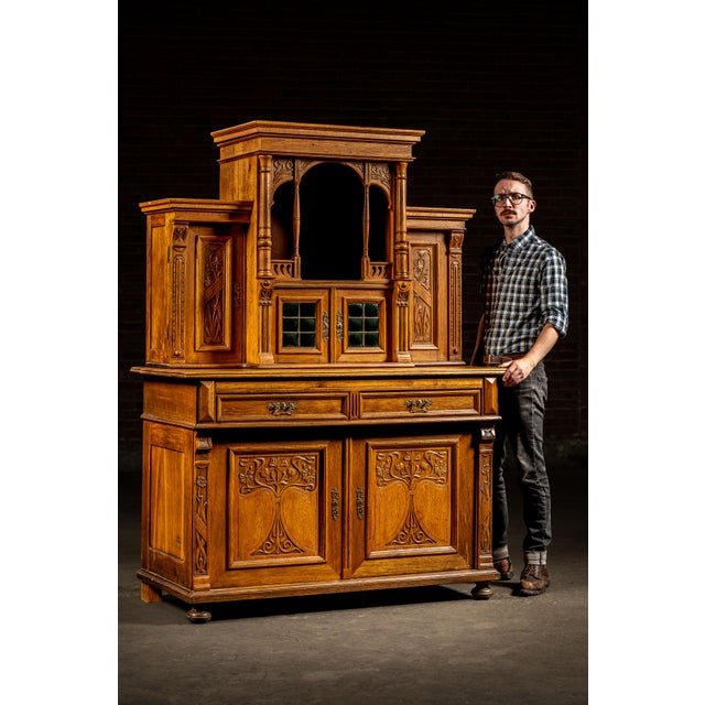 c. 1870s; Ed. Neumann - Dorotheenthal bei Arnstadt, Germany This Gothic Revival oak parlor cabinet is a striking example...