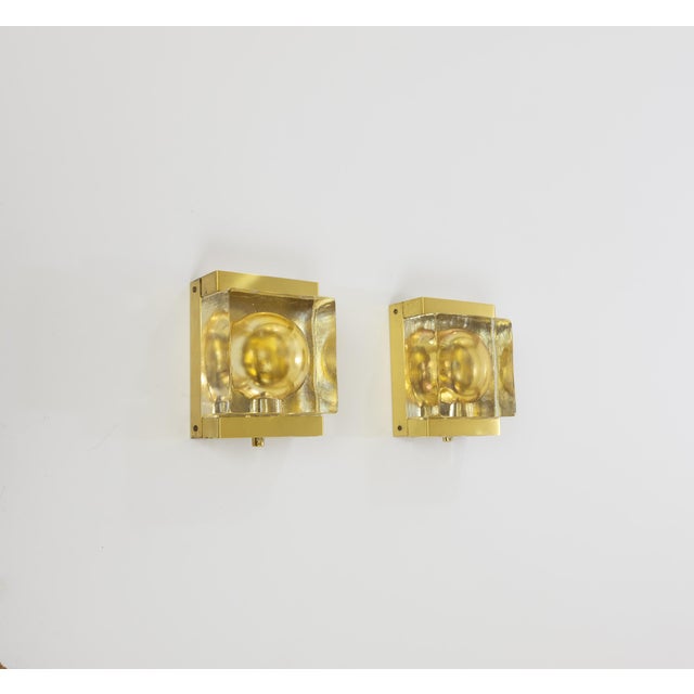 A set of two rare gold Maritim Lampet wall lamps, produced by Danish lighting manufacturer Vitrika in the 1970s. Both...