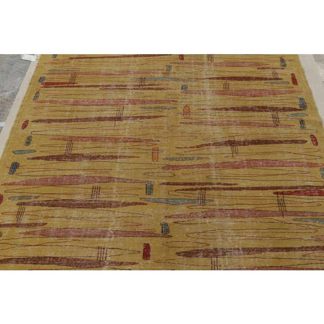 Hand-knotted in Turkey originating between 1960-1970, this vintage mid-century modern rug is the latest to join our...