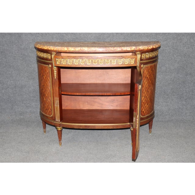 This exceptional French demi-lune commode attributed to Paul Sormani represents the highest tier of late 19th-century...
