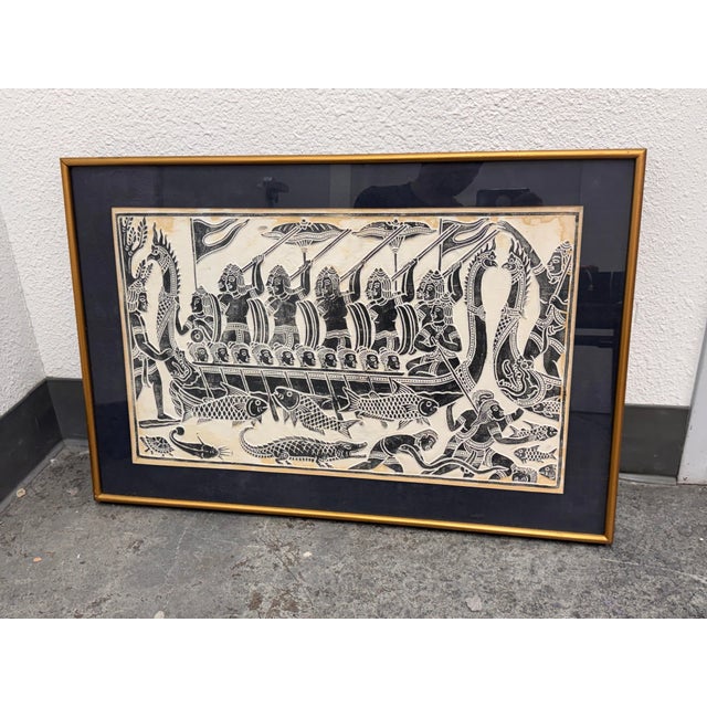 Design Plus Gallery presents a Vintage Angkor Wat Dragon Boat Rubbing. This framed rubbing depicts a ceremonial dragon...