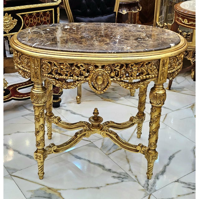 Make a dramatic statement with this French Louis XVI style coffee table, featuring an exceptionally ornate design, a...