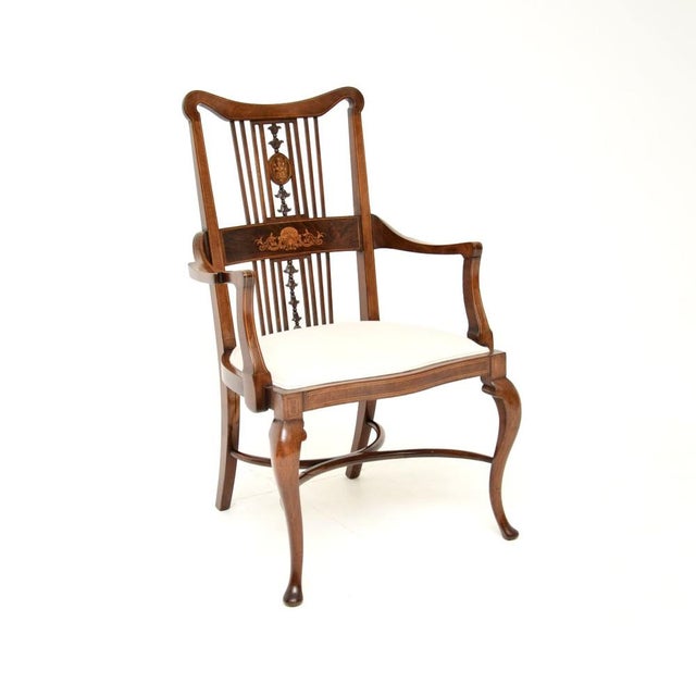 A beautiful and elegant antique Edwardian armchair. This was made in England, it dates from around 1900-1910 period. It is...