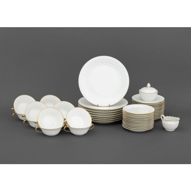 Limoges Porcelain Partial Dinner Service Set, comprising: A. Vignaud Limoges, eight dinner plates, 12 two-handled soup...
