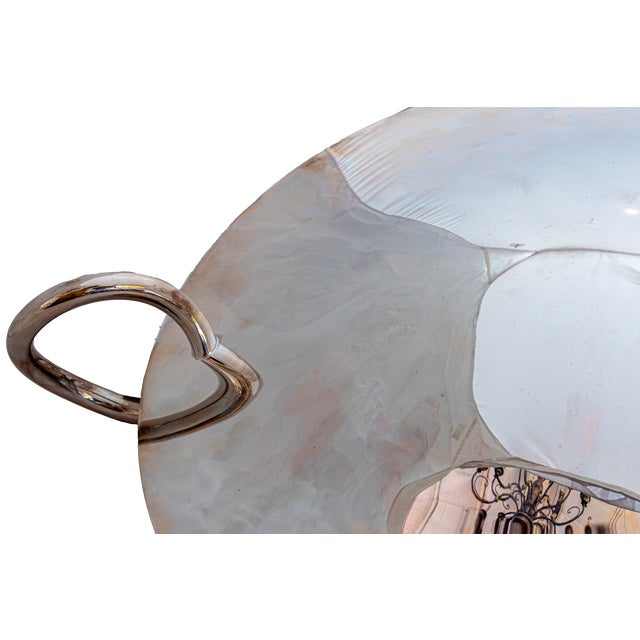 A masterful blend of timeless elegance and contemporary design, this stunning Vertigo Centerpiece was created by the...