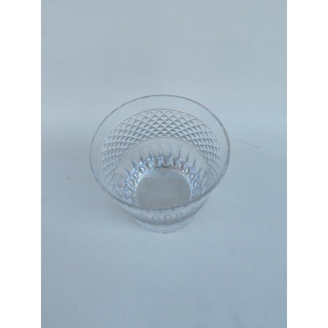 Baccarat crystal ice bucket. Signed. A very beautiful model featuring both diamond points and beveled edges. Some very...