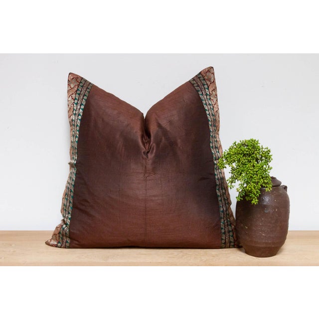 This brilliant silk euro pillow is a luxurious addition to any living room. Made out of silk with intricate borders of...