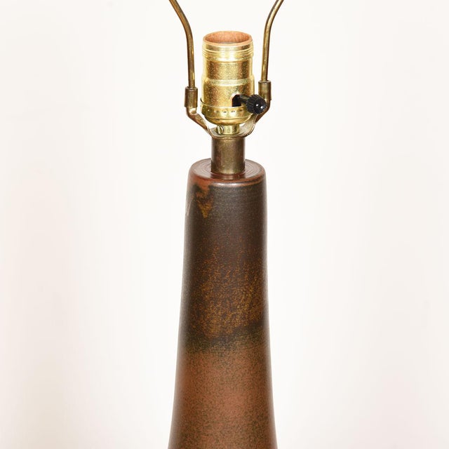 From Bostlund of Sweden, the beautiful form and expressive earth tone brown finish on the pottery combine to make this a...