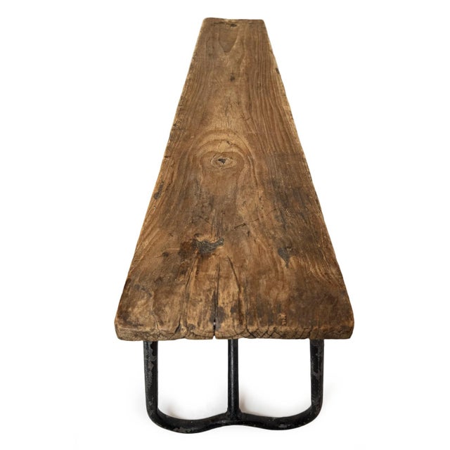 Vintage rustic wood and iron school bench. Characteristic signs of age and use add to the unique and special qualities of...