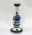 A classic Delft bulb vase with an elongated neck opening up to a flared rim, resting on a bulbous body and a ringed...