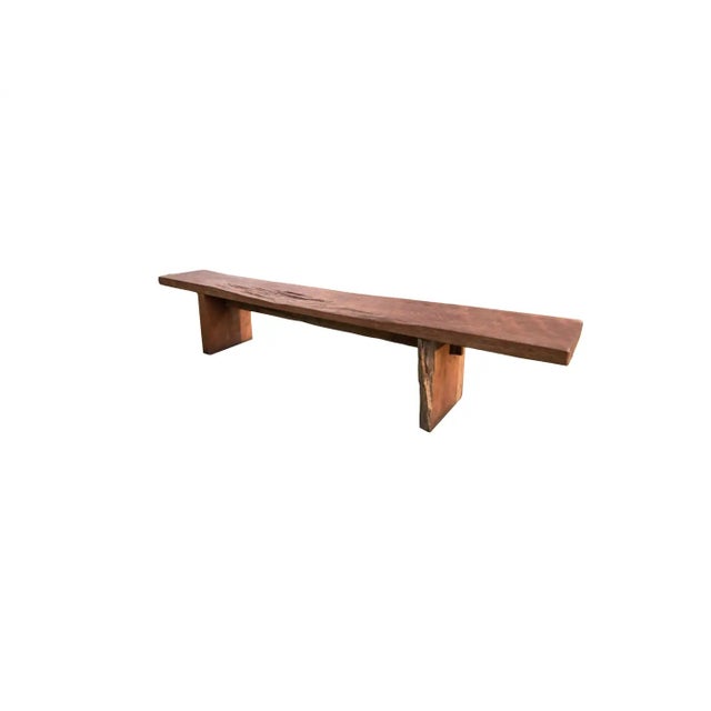 This solid teak wood bench originates from the Island of Madura, off the coast of Northeastern Java. It features a...