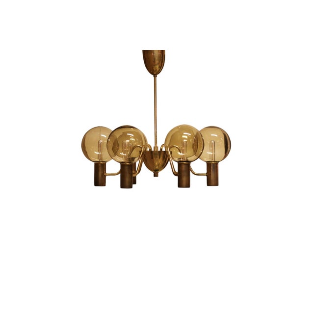 Hans-agne jakobsson's classic ceiling lamp in model t-372/6 patricia. The lamp is manufactured by the company hans-agne...