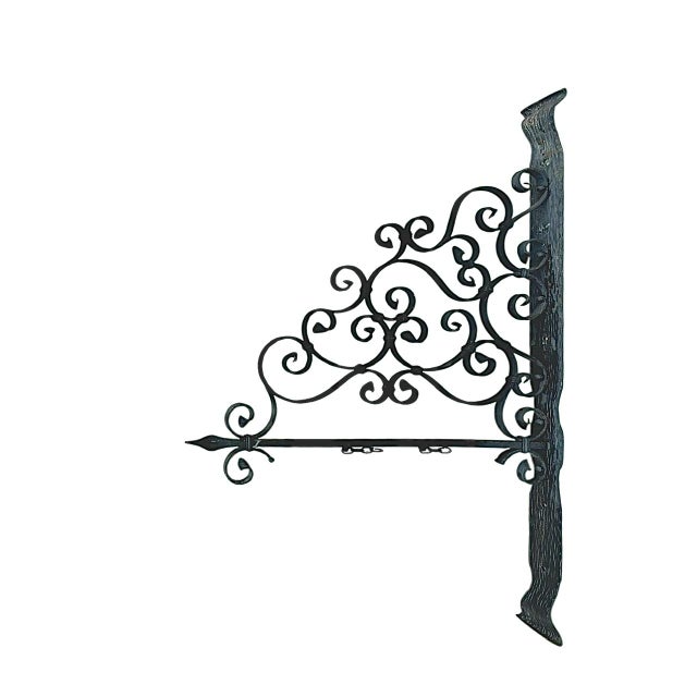 Elegant real old (no copy) wrought iron wall bracket, featuring richly detailed scrollwork. Traditionally used as a sign...