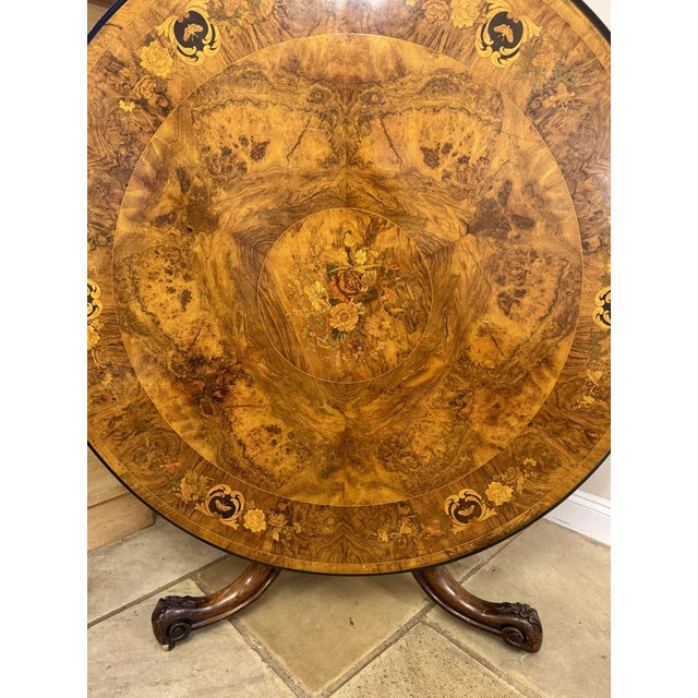 Fantastic quality antique Victorian burr walnut and foliate marquetry circular centre table, having a quality antique...