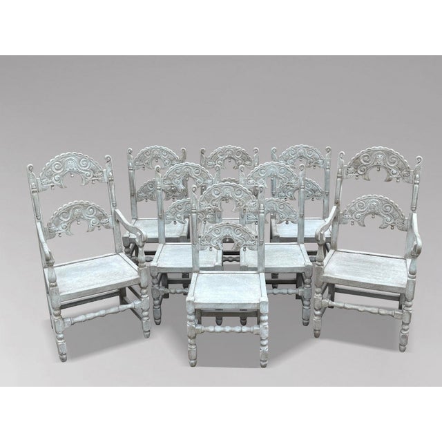 A handsome and highly decorative set of eight painted carved oak derbyshire dining chairs, circa 1910, in the 17th century...