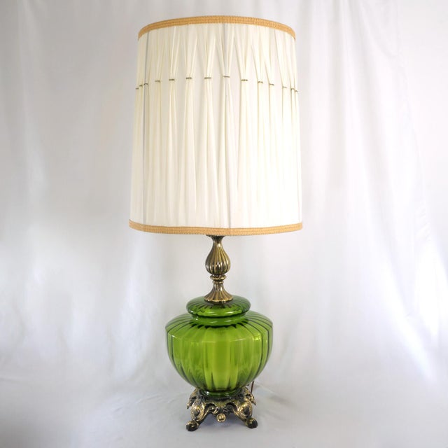 This pair of large vintage table lamps is styled in the Hollywood Regency aesthetic, featuring ribbed green Empoli glass...
