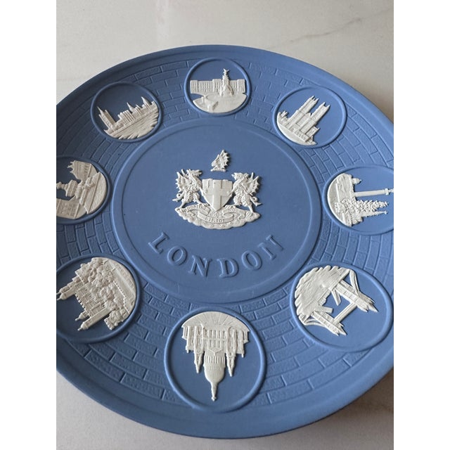 A refined vintage Wedgwood jasperware plate celebrating the iconic architecture and monuments of London. Rendered in...