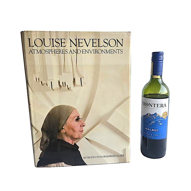 Offered is a monograph art book, "Louise Nevelson: Atmospheres and Environments", with an essay by playwright Edward...