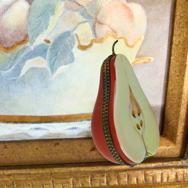 Add a touch of French elegance to your curio cabinet with this Limoges "Half Pear" porcelain hinged trinket box. Hand-...