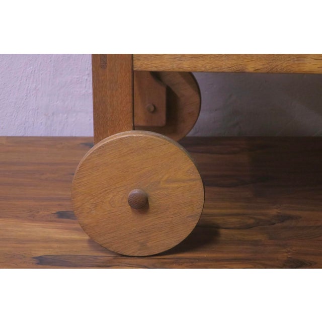 Striking and rare Scandinavian bar cart in solid oak dating from the 1950s-1960s.