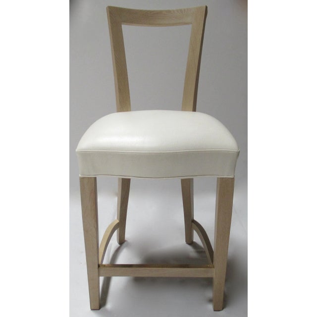 C.1990's: John Hutton Collection, "Hutton," counter stool in a Cerused finish of white oak, with the seat upholstered in...