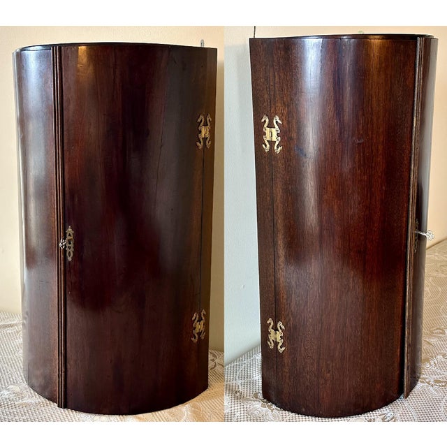 Antique Georgian Mahogany Bow Front Corner Cupboard for your consideration. The cabinet measures approx. 27 1/2 inches...