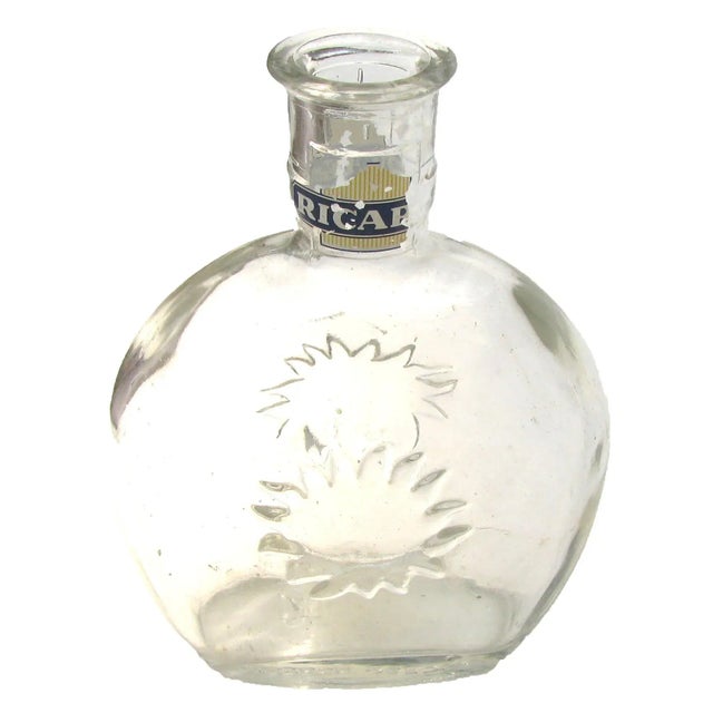 Pair of traditional French Bistro carafes sourced at an antique market in Provence. The pieces bear the Ricard sunburst...