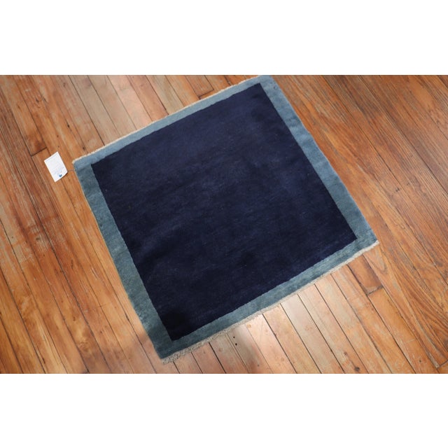 One of a kind, mid 20th-century Hand-knotted Chinese Art Deco Small Square Rug with solid navy field surrounded by a light...