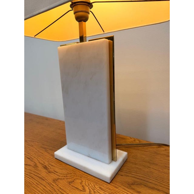 Elegant sculptural table lamp designed by Belgian designer Camille Breesch, featuring a refined minimalist composition...