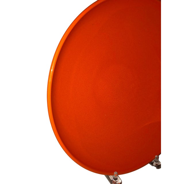 A vintage pottery bowl in orange marked on bottom West Germany.