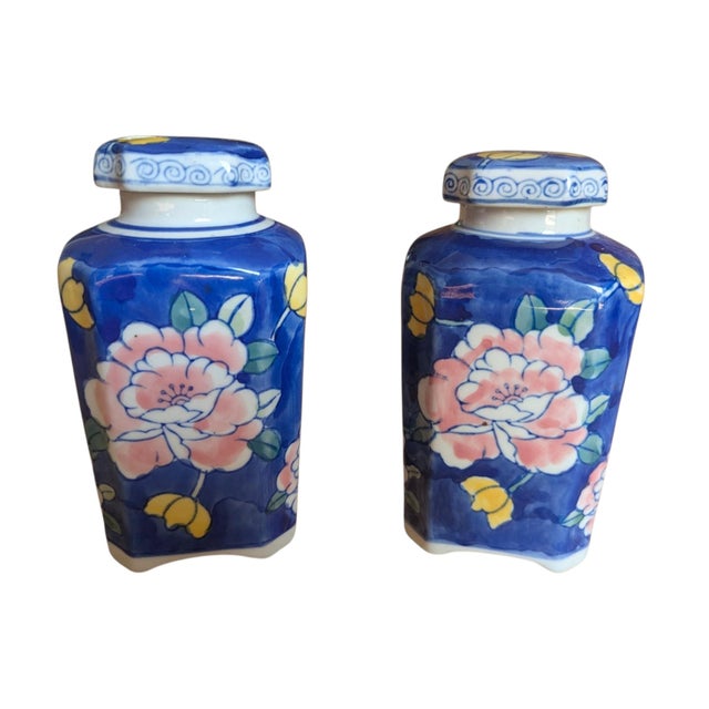 A Pair of Vintage Chinoiserie Asian Ceramic Vases with Lids They measure 5.75" Tall with Lids They measure 5.25" Tall...