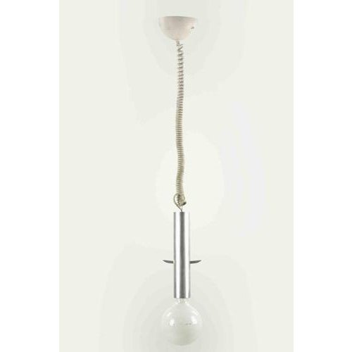 Pendant light is an original design lamp realized in the 1970s by Gaetano Sciolari. A minimal and elegant lamp with a...
