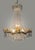 An exquisite Empire-style vintage French chandelier featuring a grand cascading silhouette and timeless elegance. Crafted...