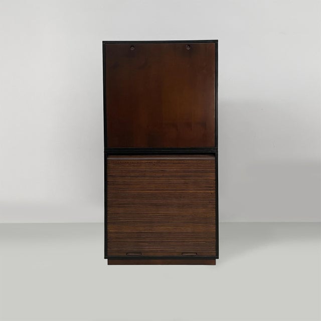 Italian modern cabinet by Le Corbusier for Cassina, 1990s Dark brown wooden highboard with two sections. The upper section...