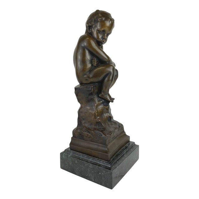 A Patinated Bronze Figure Of A Seated Cupid. Sculpture is signed Eugène Marioton (7 April 1857, Paris - 1933). He was a...