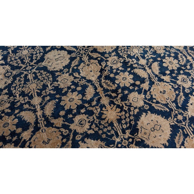 A late 19th century Indian Agra rug from Agra Indian Rugs collection, the midnight blue field with a palmette, flowerhead...