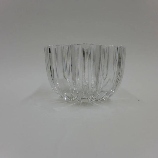 Decorative, clear glass bowl with undulating motif. Signed.
