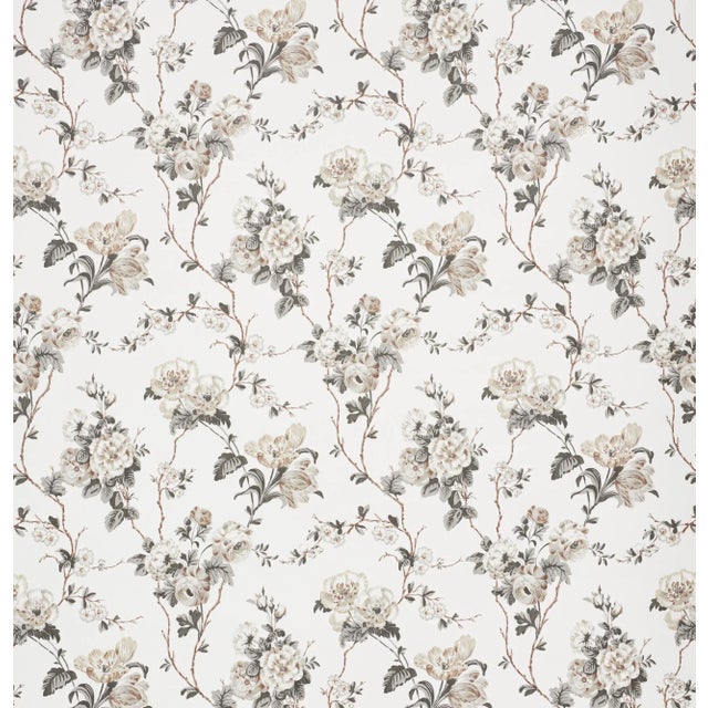 A lush tangle of tulips, roses and ranunculi climbs a trellis of branches in this gorgeous wallpaper design. Since...