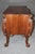 This extraordinary English mahogany serpentine commode, conceived in the grand Georgian tradition associated with Thomas...