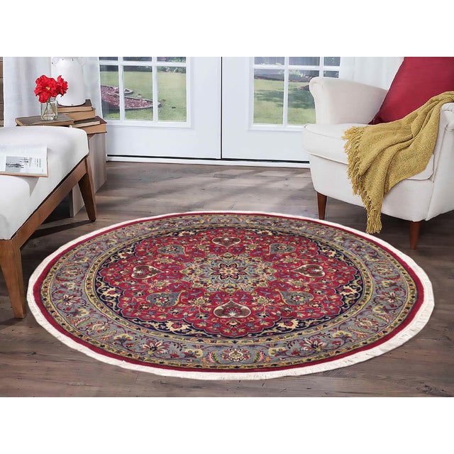 This hand‑knotted Pak Persian round rug showcases the finest expression of traditional Persian artistry. Each piece is...
