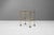 Early 20th Century two tier drinks trolley in solid brass with original glass shelves. Signs of wear on the glass. Good...